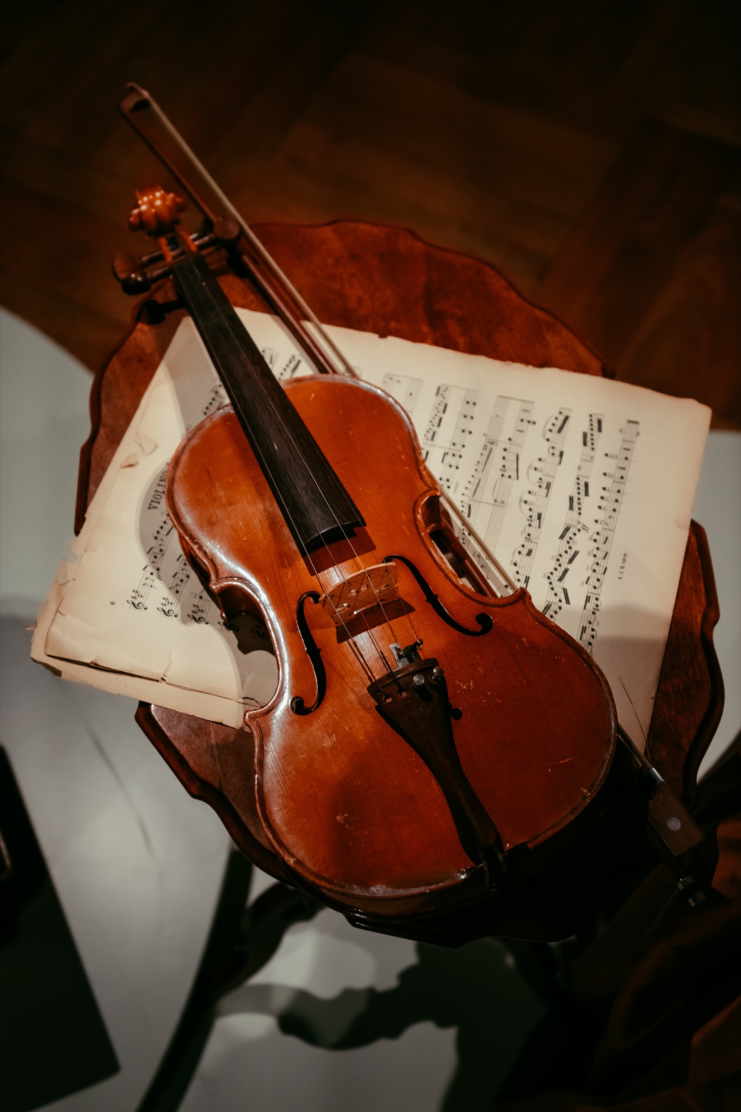 A violin resting on sheet music