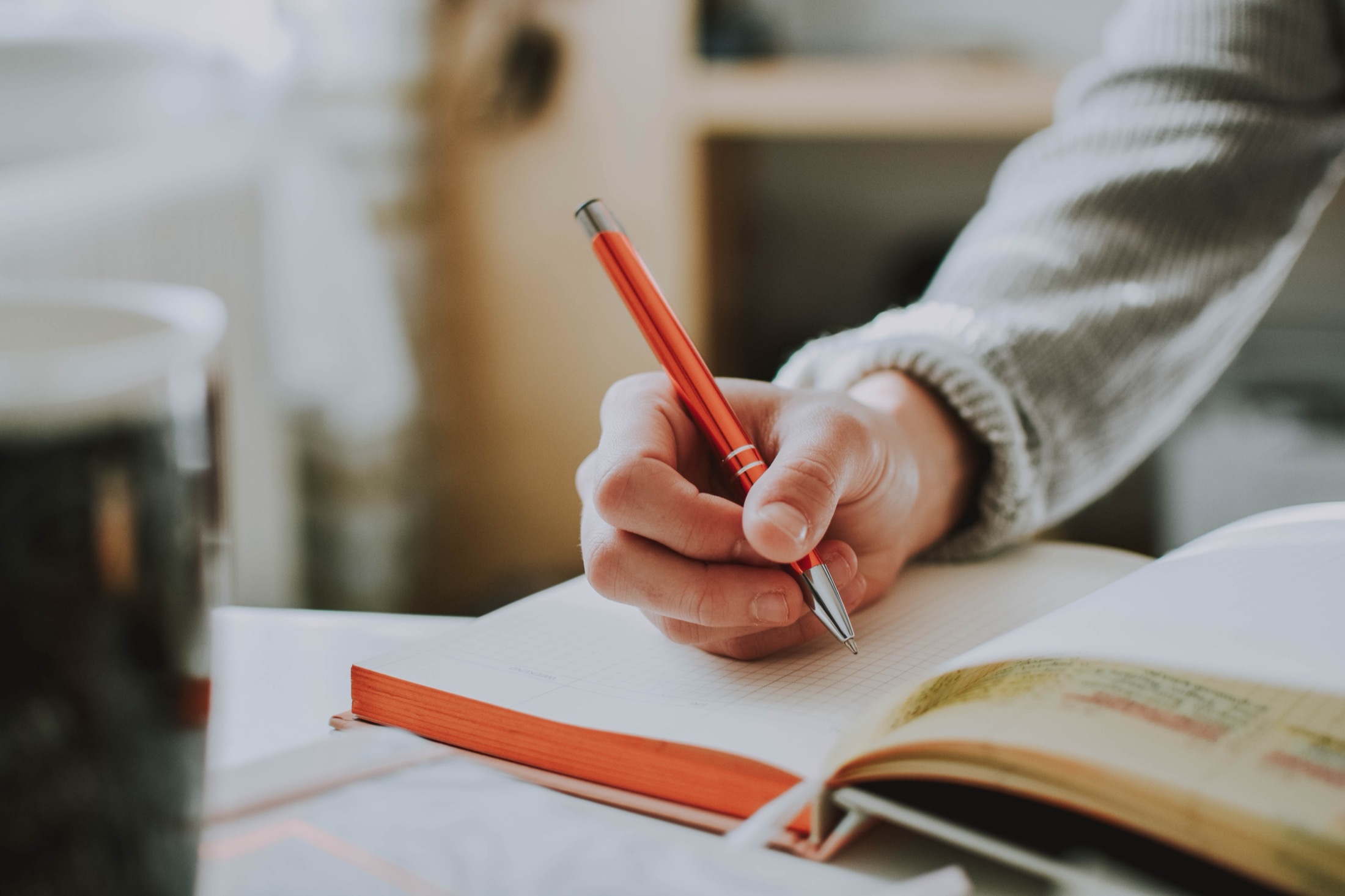 A hand writing on paper